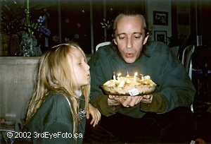 Kaelin and Adrian blowing out candles